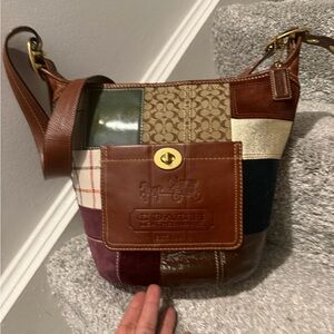 Coach Bleecker Holiday Patchwork Duffle referred to as a bucket bag or hobo